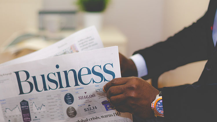 businessman reading newspaper