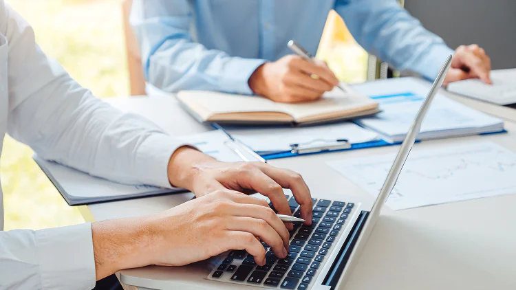 business man writing and discussing